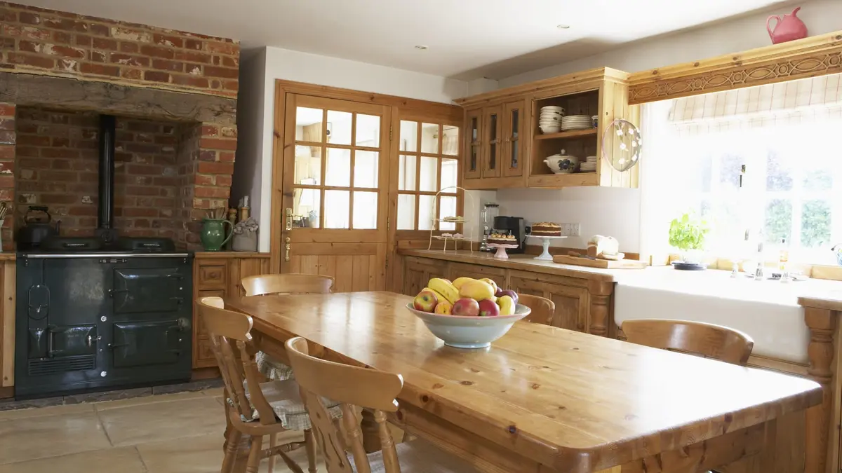 classic farmhouse kitchen layout with wood accents and natural light shining in