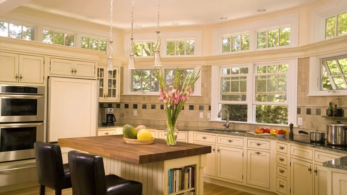 rounded kitchen wall with natural light streaming in makes a great welcoming kitchen layout